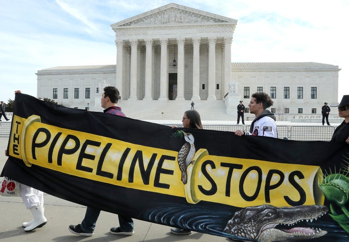 Climate activist groups protest the Atlantic Coast Pipeline in front of the Supreme Court in February 2020. Duke Energy Corp. and Dominion Energy Inc., the companies behind the controversial project, canceled it later that year “due to ongoing delays and increasing cost uncertainty.”