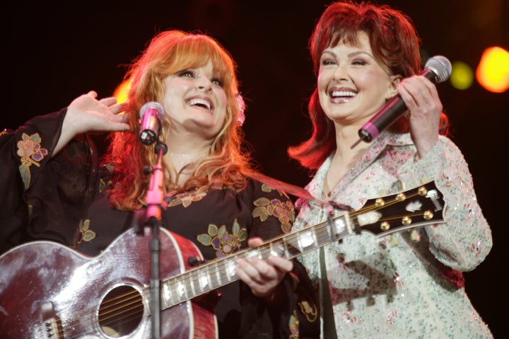 Wynonna Judd reunites with her mom Naomi Judd during Wynonna Judd and Naomi Judd Perform Together During Fan Fair Week at Adelphia Coliseum in Nashville, Tennessee, United States.