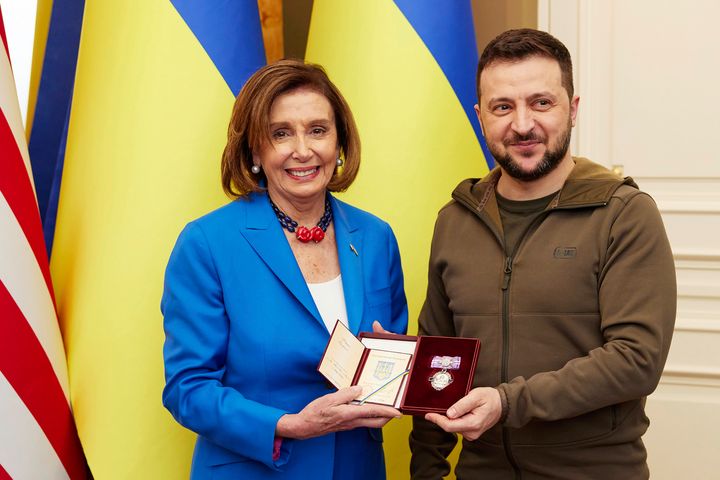 In this image released by the Ukrainian Presidential Press Office on Sunday, May 1, 2022, Ukrainian President Volodymyr Zelenskyy, right, awards the Order of Princess Olga, the third grade, to U.S. Speaker of the House Nancy Pelosi in Kyiv, Ukraine, Saturday, April 30, 2022. Pelosi, second in line to the presidency after the vice president, is the highest-ranking American leader to visit Ukraine since the start of the war, and her visit marks a major show of continuing support for the country's struggle against Russia. (Ukrainian Presidential Press Office via AP)