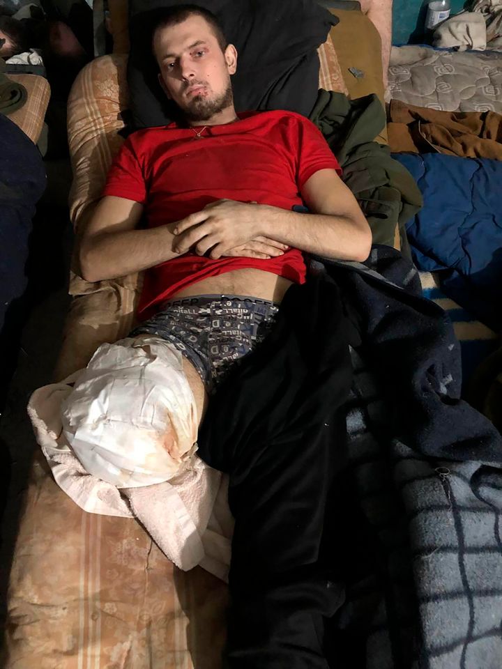 This recent but undated photo provided Friday, April 29, 2022 by the wife of a member of the Azov Regiment shows an unidentified wounded man lying on a mattress inside the Azovstal steel plant in Mariupol, in eastern Ukraine.
