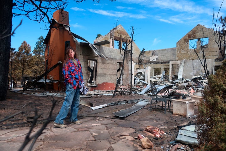 Jeanne Welnik stood in the ruins of her home on the outskirts of Flagstaff, Arizona on Thursday, April 28, 2022. A large bushfire that broke out on Easter Sunday burned approximately 30 square miles and more than a dozen homes.