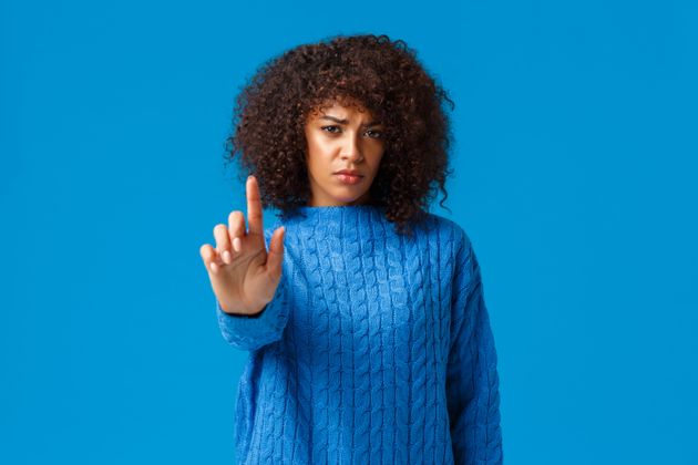 You should stop. Concerned friend asking quit smoking, bad health. Displeased upset young african-american worried girlfriend with afro haircut, stretch index finger camera in prohibition, warning.