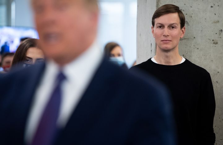 Jared Kushner listens as then-President Donald Trump visits his campaign headquarters in 2020.