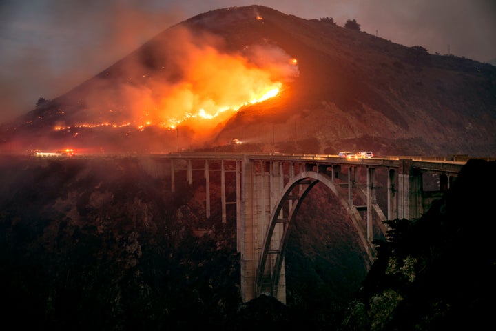 The Colorado Fire burns down toward the Bixby Bridge in Big Sur, California, early Saturday morning, Jan. 22, 2022. 