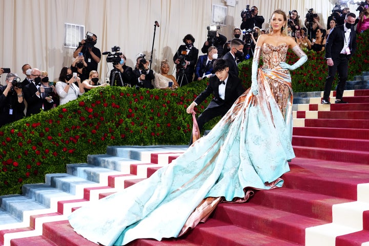 A large knot on the skirt of Lively’s dress unraveled to showcase a long blue train.