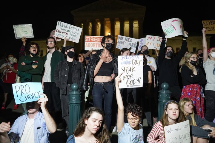 A crowd gathers outside the Supreme Court on Monday night after a leaked draft opinion indicated the court is poised to overturn Roe v. Wade.