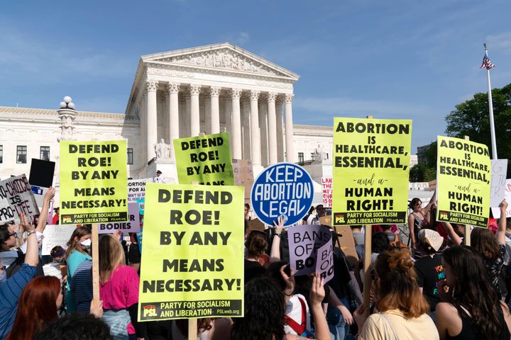 Demonstrators protest outside of the U.S. Supreme Court on Tuesday.