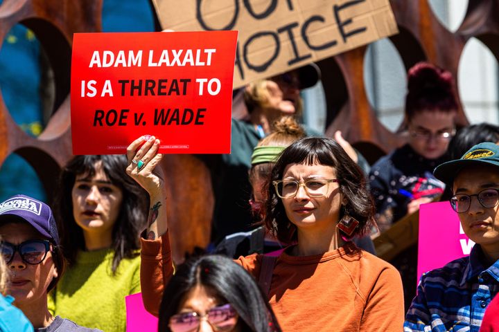 A sign opposing Nevada Senate candidate Adam Laxalt is seen outside the federal courthouse during a demonstration in Reno, Nevada, this week.