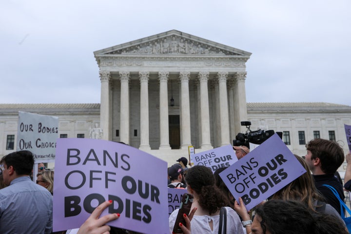 Activists rally outside the U.S. Supreme Court the day after the draft leaked. 