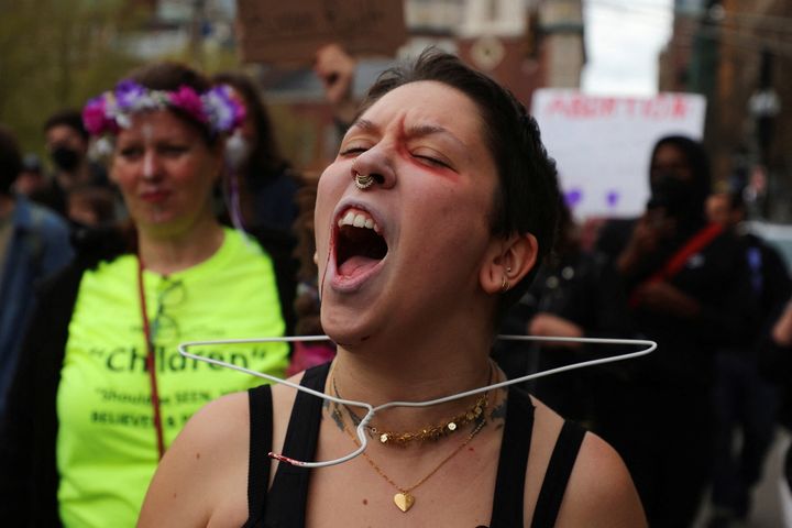 A protester with a hanger around her neck demonstrates in Boston this week. 