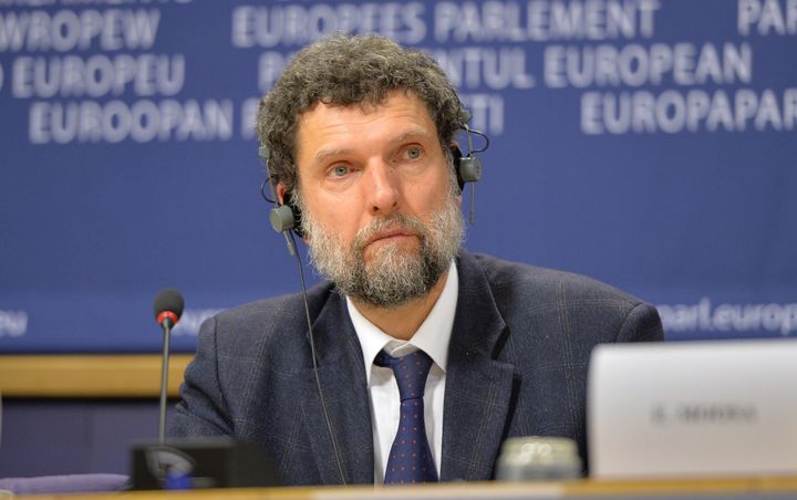 BRUSSELS, BELGIUM - DECEMBER 11: Member of the International Peace and Reconciliation Initiative (IPRI) delegation to Turkey Osman Kavala is seen during a joint press conference with Chair of the Confederal Group of the European United Left - Nordic Green Left at the European Parliament Gabriele Zimmer, Chair of IPRI Judge Essa Moosa, French politician Francis Wurtz and Chair of the EU Turkey Civic Commission (EUTCC) Kariane Westrheim after 11th International Conference on the European Union, Turkey, the Middle East and the Kurds at European Parliament headquarters in Brussels, Belgium on December 11, 2014. (Photo by Dursun Aydemir/Anadolu Agency/Getty Images)