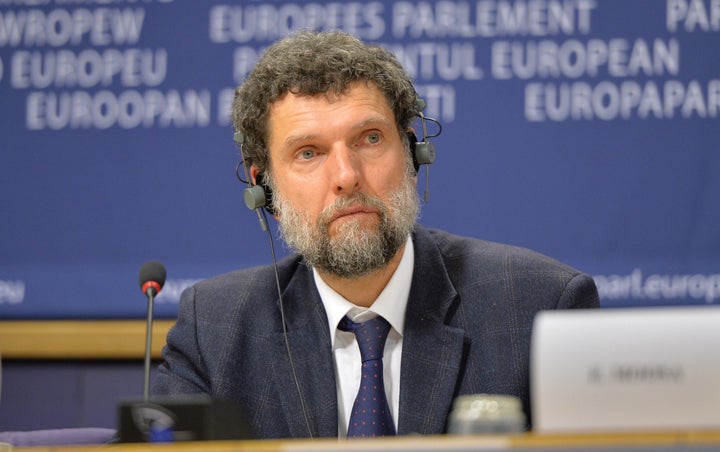 BRUSSELS, BELGIUM - DECEMBER 11: Member of the International Peace and Reconciliation Initiative (IPRI) delegation to Turkey Osman Kavala is seen during a joint press conference with Chair of the Confederal Group of the European United Left - Nordic Green Left at the European Parliament Gabriele Zimmer, Chair of IPRI Judge Essa Moosa, French politician Francis Wurtz and Chair of the EU Turkey Civic Commission (EUTCC) Kariane Westrheim after 11th International Conference on the European Union, Turkey, the Middle East and the Kurds at European Parliament headquarters in Brussels, Belgium on December 11, 2014. (Photo by Dursun Aydemir/Anadolu Agency/Getty Images)