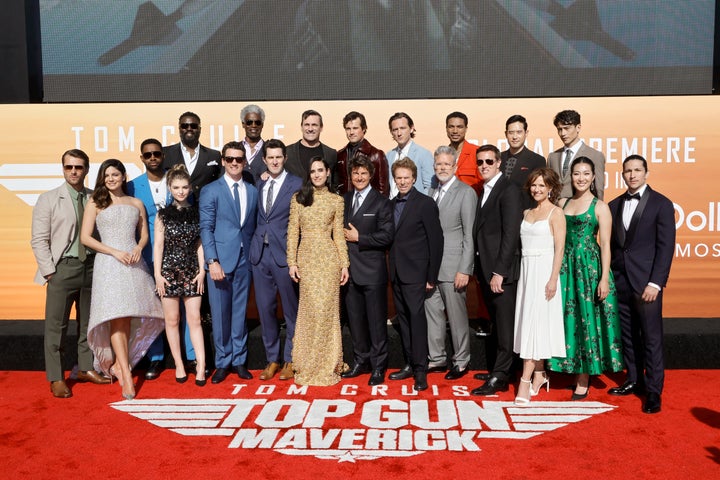 (L-R) Glen Powell, Monica Barbaro, Jay Ellis, Bashir Salahuddin, Lyliana Wray, Miles Teller, Charles Parnell, Joseph Kosinski, Jon Hamm, Jennifer Connelly, Jake Picking, Tom Cruise, Lewis Pullman, Jerry Bruckheimer, Christopher McQuarrie, Greg Tarzan Davis, David Ellison, Raymond Lee, Jean Louisa Kelly, Manny Jacinto, Kara Wang and Danny Ramirez attend the Global Premiere of "Top Gun: Maverick" on May 04, 2022 in San Diego, California. (Photo by Kevin Winter/Getty Images for Paramount Pictures)