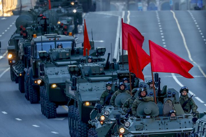Russian military vehicles move along the street during the rehearsa