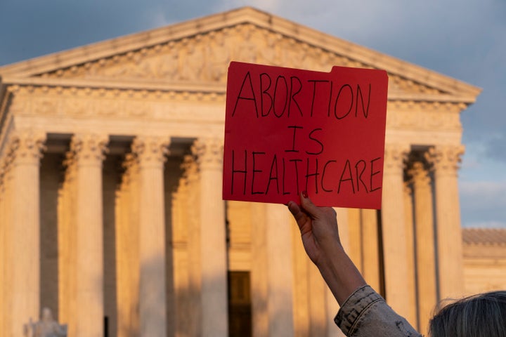 Demonstrators protest outside of the U.S. Supreme Court, Wednesday, May 4, 2022, in Washington. (AP Photo/Alex Brandon)