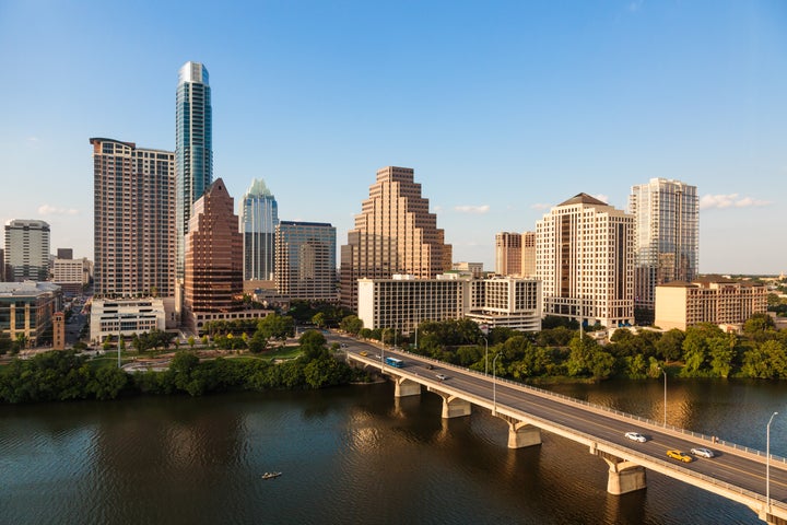 Austin's skyline including the Congress Avenue bridge over Ladybird Lake.