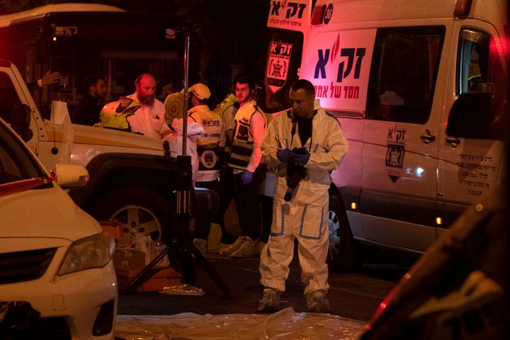 An Israeli police officer investigates the scene of a stabbing attack in the town of Elad, Israel, onn May 5, 2022. 
