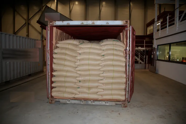 A container with coffee bean bags and cocaine