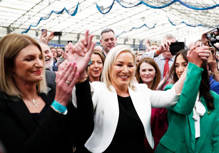 Sinn Fein's Michelle O'Neill, centre, reacts with party colleagues after being elected in Mid Ulster at the Medow Bank election count centre in Magherafelt, Northern Ireland.