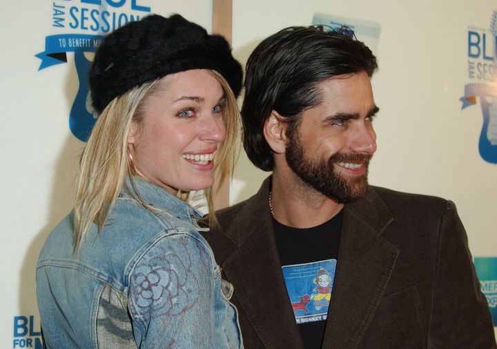 Rebecca Romijn (left) and John Stamos in 2003. 
