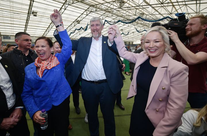 Sinn Féin northern leader Michelle O'Neill (R) and Sinn Féin leader Mary Lou McDonald celebrate with party candidate John O'Dowd after he was elected in Northern Ireland's Election at the Meadowbank count on May 07, 2022 in Magherafelt, United Kingdom.