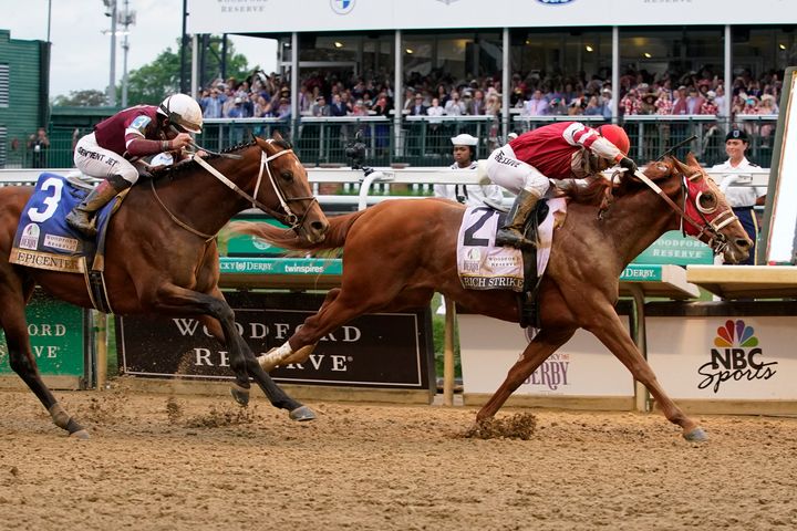 Rich Strike (21), with Sonny Leon aboard, beats Epicenter (3), with Joel Rosario aboard, astatine  the decorativeness  enactment     to triumph   the 148th moving  of the Kentucky Derby equine  contention    astatine  Churchill Downs Saturday, May 7, 2022, successful  Louisville, Ky. (AP Photo/Mark Humphrey)