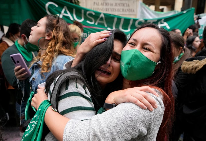 Abortion-rights activists celebrate after the Constitutional Court approved the decriminalization of abortion, lifting all limitations on the procedure until the 24th week of pregnancy, in Bogota, Colombia, Monday, Feb. 21, 2022. Colombia, where the Constitutional Court in February legalized abortion until the 24th week of pregnancy, is part of a broader trend seen in parts of heavily Catholic Latin America. (AP Photo/Fernando Vergara, FIle)