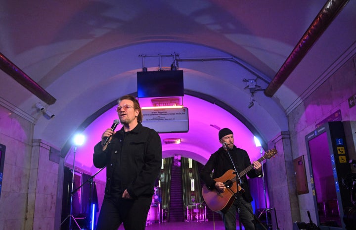 Bono, Irish singer-songwriter (left), and David Howell Evans aka 'The Edge,' lead vocalist and guitarist of U2 (right), perform at a subway station that is also a bomb shelter in Kyiv, Ukraine on May 8.