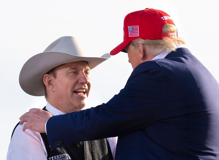 Nebraska Republican gubernatorial candidate Charles Herbster, left, shakes hands with former President Donald Trump during a campaign rally in Greenwood, Nebraska.