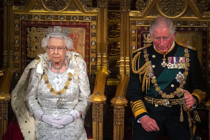 Queen Elizabeth II sits with Prince Charles on the Sovereign's throne to deliver the Queen's Speech at the State Opening of Parliament in the Houses of Parliament in 2019.