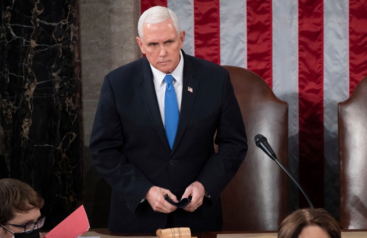 Then-Vice President Mike Pence is seen presiding over a joint session of Congress as it convenes to count the Electoral College votes cast in the 2020 election at the Capitol.