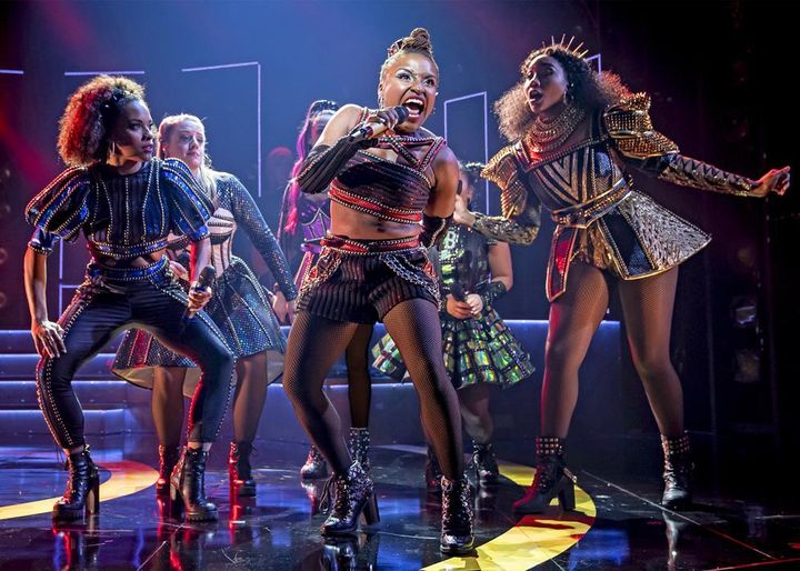 This image released by Boneau/Bryan Brown shows Brittney Mack, center, during a performance of "Six."