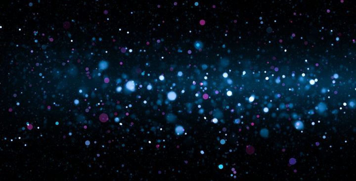 Defocused Particles and Lights over Dark Background