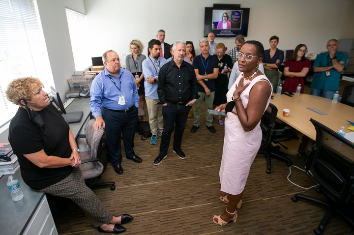 Monica Richardson, the executive editor of the Miami Herald, el Nuevo Herald and Bradenton Herald, right, speaks after her newsroom was awarded the Pulitzer Prize in Breaking News Reporting for their coverage of the Champlain condo collapse on Monday, May 9, 2022, in Doral, Florida.