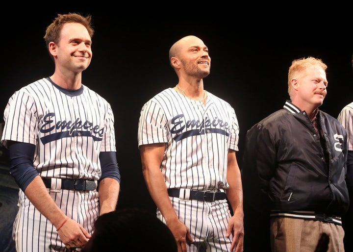 Jesse Williams, flanked by Patrick J. Adams and Jesse Tyler Ferguson, during an opening night curtain call of Take Me Out.