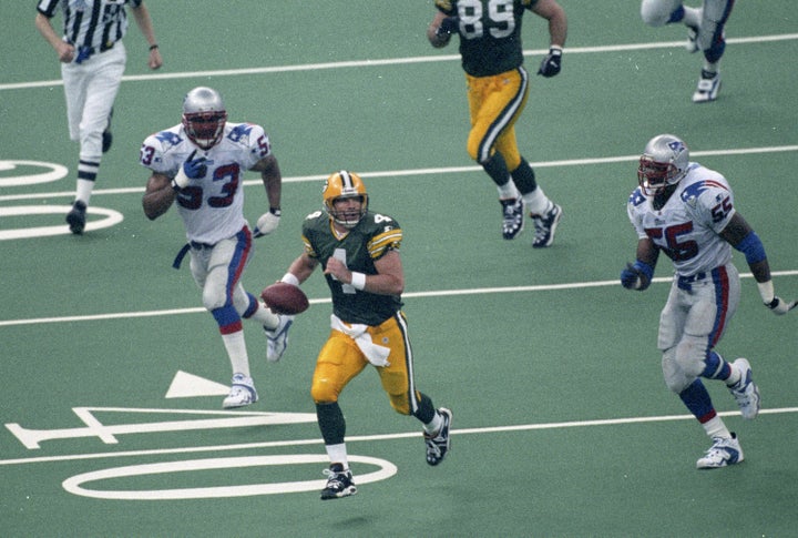 Brett Favre on the run during the Packers' 1996 Super Bowl victory over the New England Patriots.