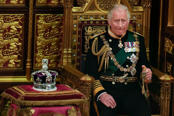 Prince Charles seated next to the Queen's imperial state crown in the House of Lords.