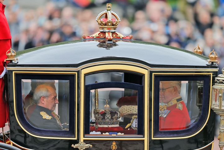 <strong>The imperial state crown travels in a carriage from Buckingham Palace towards parliament in 2016.</strong>