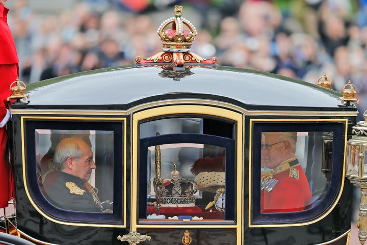 The imperial state crown travels in a carriage from Buckingham Palace towards parliament in 2016.