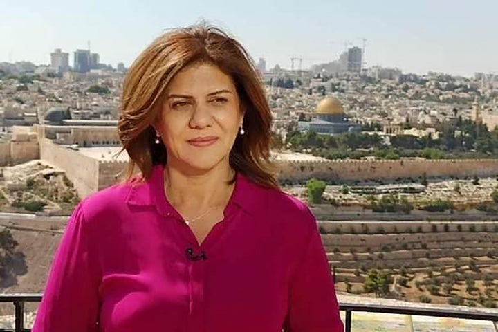 In this undated photo provided by Al Jazeera Media Network, Shireen Abu Akleh stands in an area where the Dome of the Rock shrine at Al-Aqsa Mosque in the Old City of Jerusalem is seen at right in the background. Abu Akleh, a well-known Palestinian reporter for the broadcaster's Arabic language channel, was shot and killed while covering an Israeli raid in the occupied West Bank town of Jenin early Wednesday, May 11, 2022.