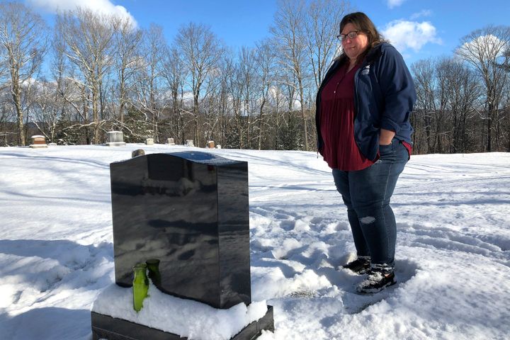 Deb Walker visits the grave of her daughter, Brooke Goodwin, on Dec. 9, 2021, in Chester, Vt. Goodwin, 23, died in March of 2021 of a fatal overdose of the powerful opioid fentanyl and xylazine, an animal tranquilizer that is making its way into the illicit drug supply. 