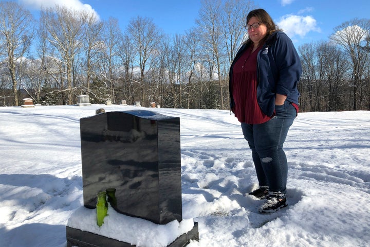 Deb Walker visits the grave of her daughter, Brooke Goodwin, on Dec. 9, 2021, in Chester, Vt. Goodwin, 23, died in March of 2021 of a fatal overdose of the powerful opioid fentanyl and xylazine, an animal tranquilizer that is making its way into the illicit drug supply.