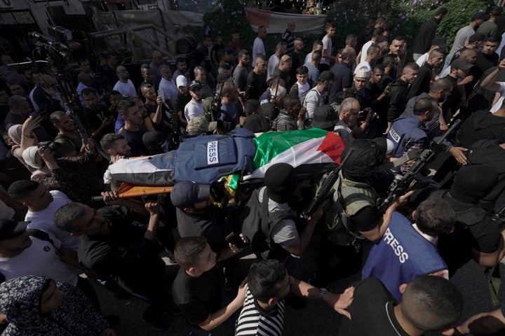 Palestinians carry the body of Shireen Abu Akleh, a journalist for Al Jazeera network, in the West Bank town of Jenin on May 11.