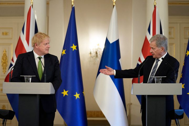 British Prime Minister Boris Johnson, left, and Finnish President Sauli Niinisto address a press conference at the presidential palace in Helsinki, Finland.