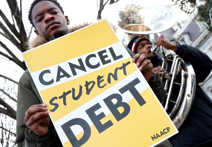 Student loan borrowers and the Too Much Talent band thank President Joe Biden and Vice President Kamala Harris for extending the student loan pause and now demand that they cancel student debt at a gathering outside The White House on Jan. 13, 2022 in Washington, D.C.