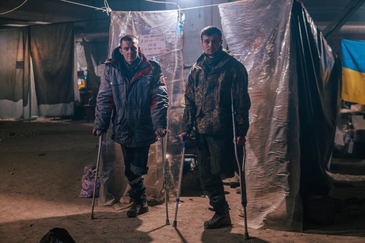 Azov Special Forces Regiment's servicemen, injured during fighting against Russian forces, pose for a photographer inside the Azovstal steel plant in Mariupol, Ukraine, on May 10, 2022.