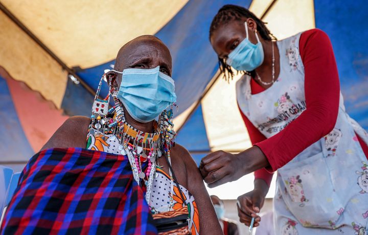 A Maasai woman receives the AstraZeneca coronavirus vaccine at a clinic in Kimana, southern Kenya on Aug. 28, 2021.