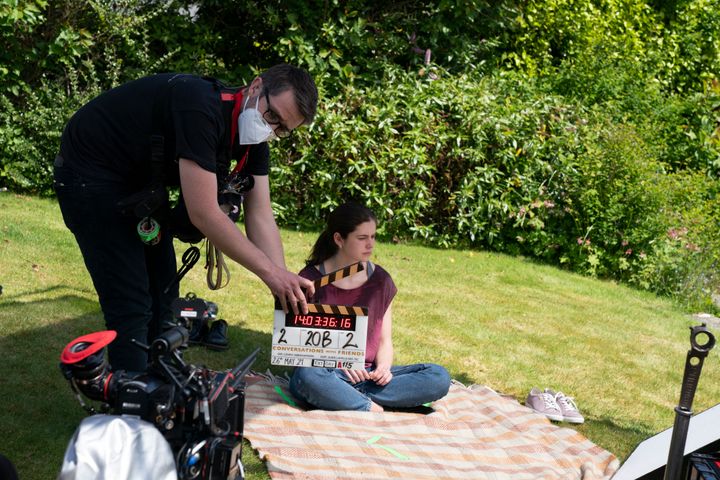 Alison Oliver during filming of the series