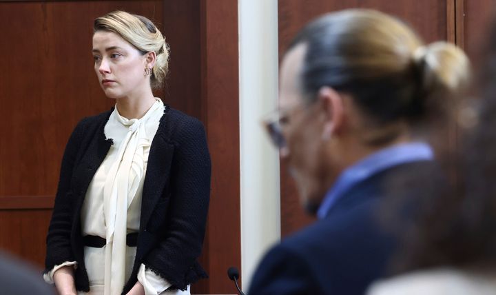 Actor Amber Heard, left, and actor Johnny Depp appear in the courtroom at the Fairfax County Circuit Court in Fairfax, Virginia, on May 5, 2022.