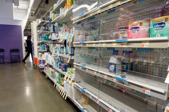 A baby formula display shelf is nearly empty Saturday at a Walgreens pharmacy in New York City.